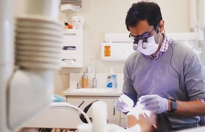Dr Sundeep Suaan at work in the surgery at Hallett Cove Smiles